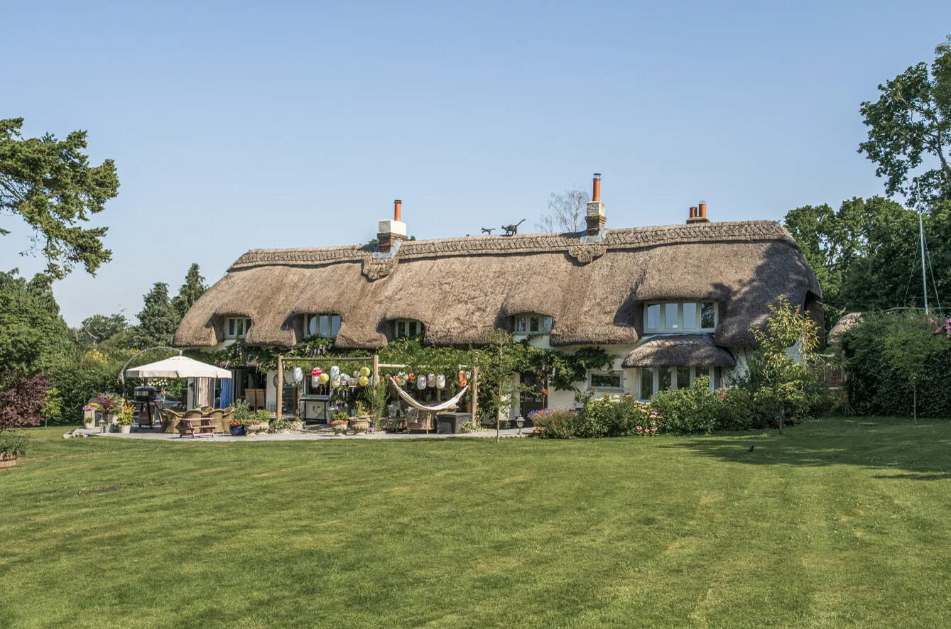 The thatched cottage and gardens