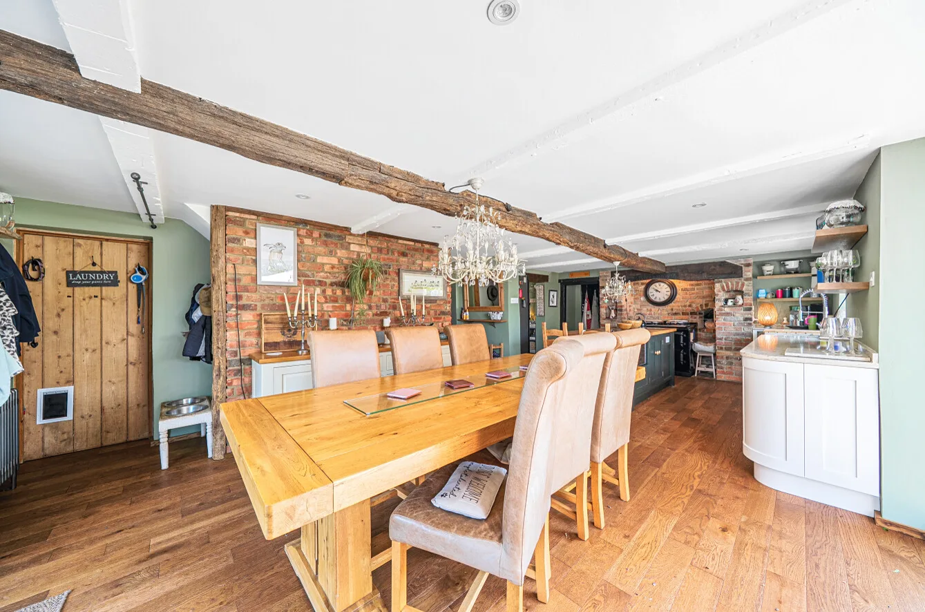 Dining table opening onto the kitchen and garden